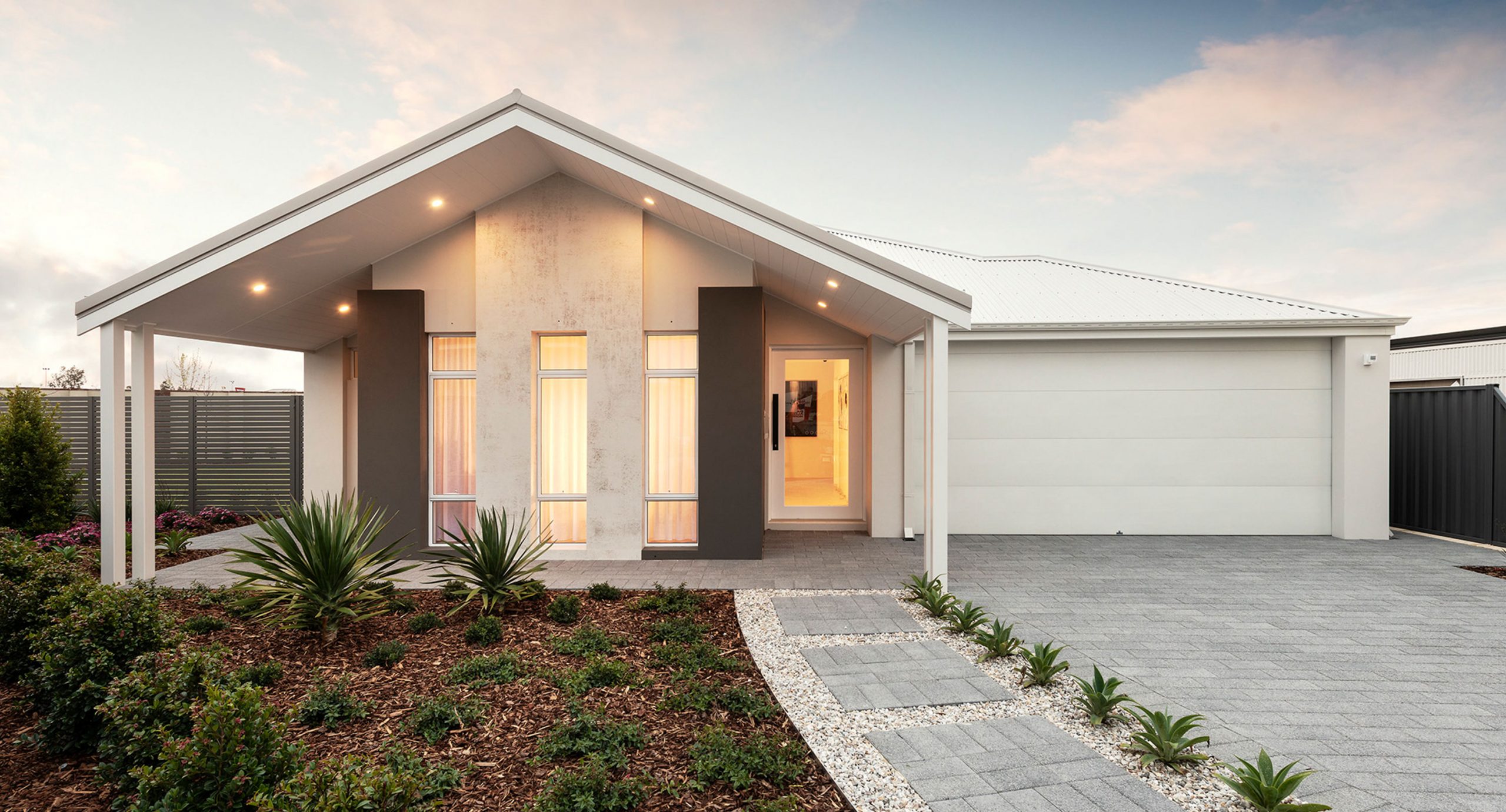 Display home with white sectional garage door